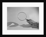 Hand Holding a Magnifying Glass by Anonymous