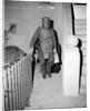 Policeman in Protective Gear Carries Bombs by Anonymous