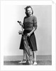 Woman Holding Golf Club And Golf Bag by Anonymous