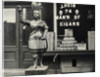 Wooden Statue In Front Of Cigar Shop by Anonymous