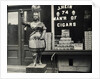 Wooden Statue In Front Of Cigar Shop by Anonymous
