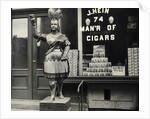 Wooden Statue In Front Of Cigar Shop by Anonymous