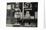 Wooden Statue In Front Of Cigar Shop by Anonymous
