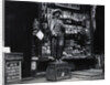 Wooden Statue In Front Of Shop Window by Anonymous