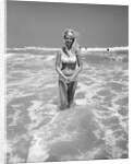 Woman Standing in Ocean Surf by Anonymous