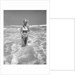 Woman Standing in Ocean Surf by Anonymous