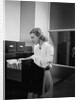 Woman and File Cabinet by Anonymous