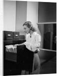 Woman and File Cabinet by Anonymous
