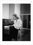 Woman and File Cabinet by Anonymous