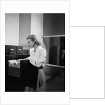 Woman and File Cabinet by Anonymous