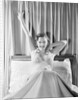 Woman Stretching in Bed by Anonymous