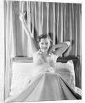 Woman Stretching in Bed by Anonymous
