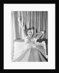 Woman Stretching in Bed by Anonymous