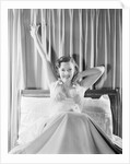 Woman Stretching in Bed by Anonymous