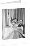 Woman Stretching in Bed by Anonymous