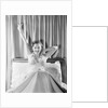 Woman Stretching in Bed by Anonymous