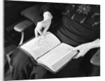 Bible in Woman's Lap by Anonymous