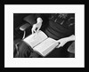 Bible in Woman's Lap by Anonymous