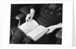 Bible in Woman's Lap by Anonymous