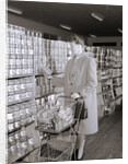 Woman Buying Food In Grocery Store by Anonymous