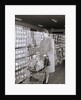 Woman Buying Food In Grocery Store by Anonymous