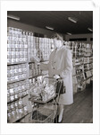 Woman Buying Food In Grocery Store by Anonymous