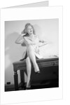 Woman Seated on Desk with Legs Crossed by Anonymous