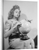 Woman Seated with Globe by Anonymous