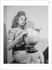 Woman Seated with Globe by Anonymous