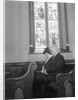 Couple Seated in Church Pew by Anonymous