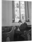 Couple Seated in Church Pew by Anonymous