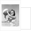 Woman Holding Beach Ball by Anonymous