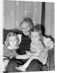 Two Girls on Grandfather's Lap by Anonymous