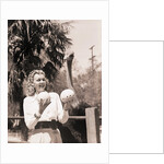 Ostrich Behind Woman Holding Its Eggs by Anonymous