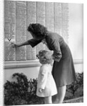 Woman And Daughter At Honor Roll Wall by Anonymous