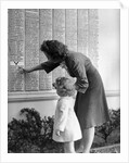 Woman And Daughter At Honor Roll Wall by Anonymous