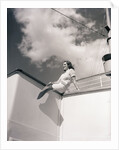 Woman Sitting on Boat Railing by Anonymous
