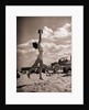 Young Woman Playing Ball On Beach by Anonymous