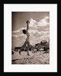 Young Woman Playing Ball On Beach by Anonymous
