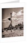 Young Woman Playing Ball On Beach by Anonymous