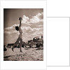 Young Woman Playing Ball On Beach by Anonymous