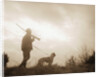 Silhouette of Hunter with Bird Dog Under Clouds by Anonymous