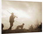 Silhouette of Hunter with Bird Dog Under Clouds by Anonymous