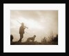 Silhouette of Hunter with Bird Dog Under Clouds by Anonymous