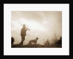 Silhouette of Hunter with Bird Dog Under Clouds by Anonymous