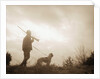 Silhouette of Hunter with Bird Dog Under Clouds by Anonymous