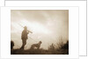 Silhouette of Hunter with Bird Dog Under Clouds by Anonymous