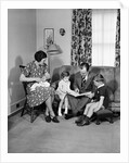 Family Sitting in Living Room by Anonymous