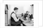 Tailor Working at Sewing Machine by Anonymous