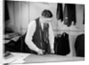 Tailor Cutting Fabric by Anonymous